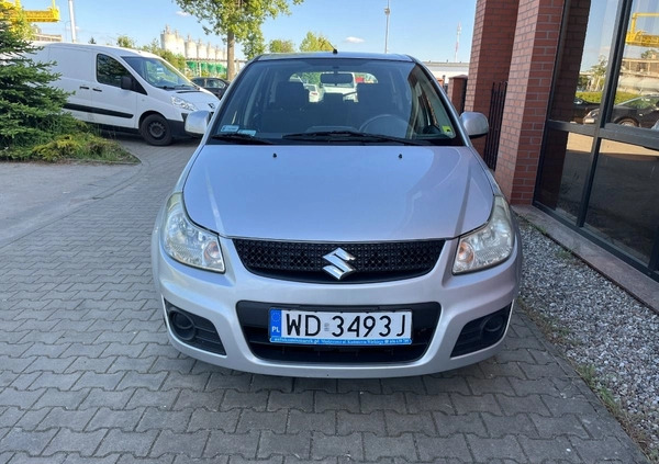 Suzuki SX4 cena 26900 przebieg: 153000, rok produkcji 2012 z Borne Sulinowo małe 254